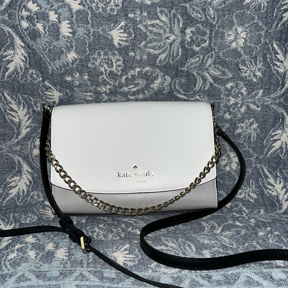 Multi color Kate spade purse with gold details